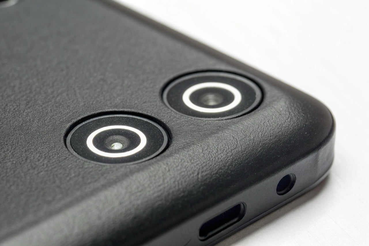 A close-up of a CE and ROHS certification mark on the back of a black electronic device