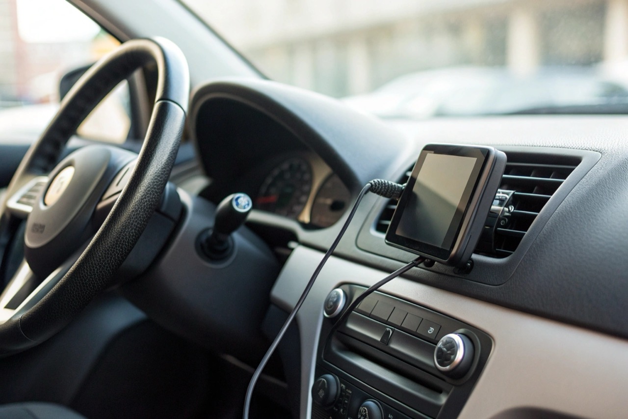 Close up of a car dashboard with a GPS device installed